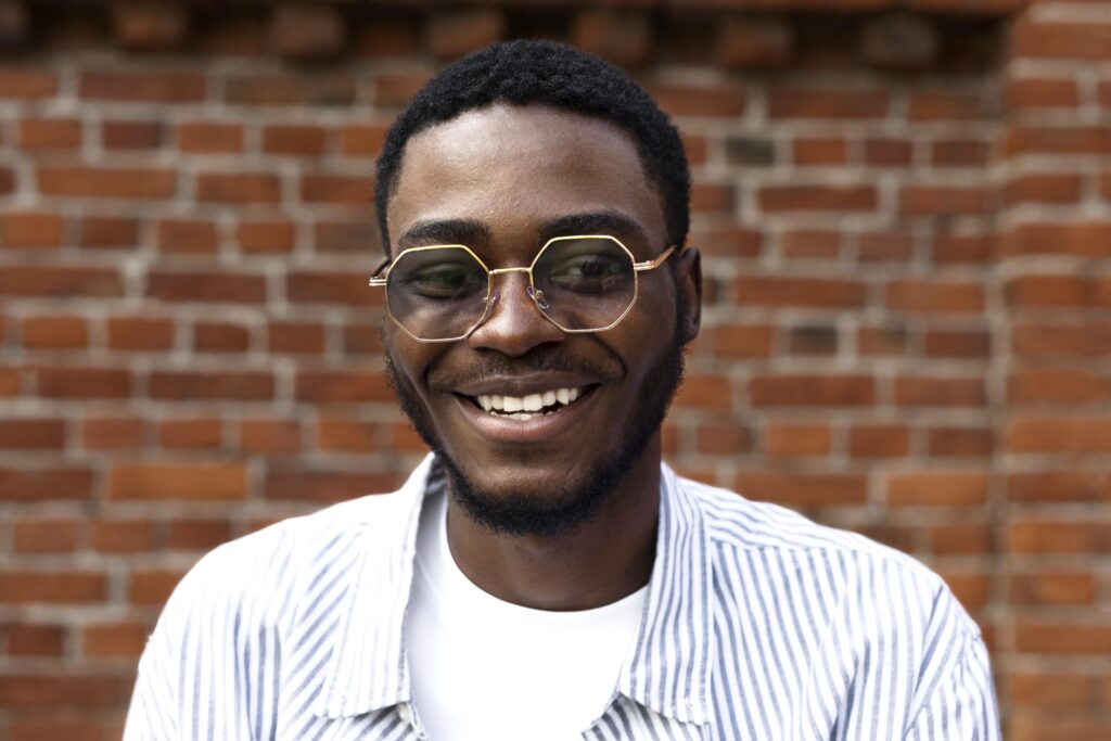 close up smiley man with glasses