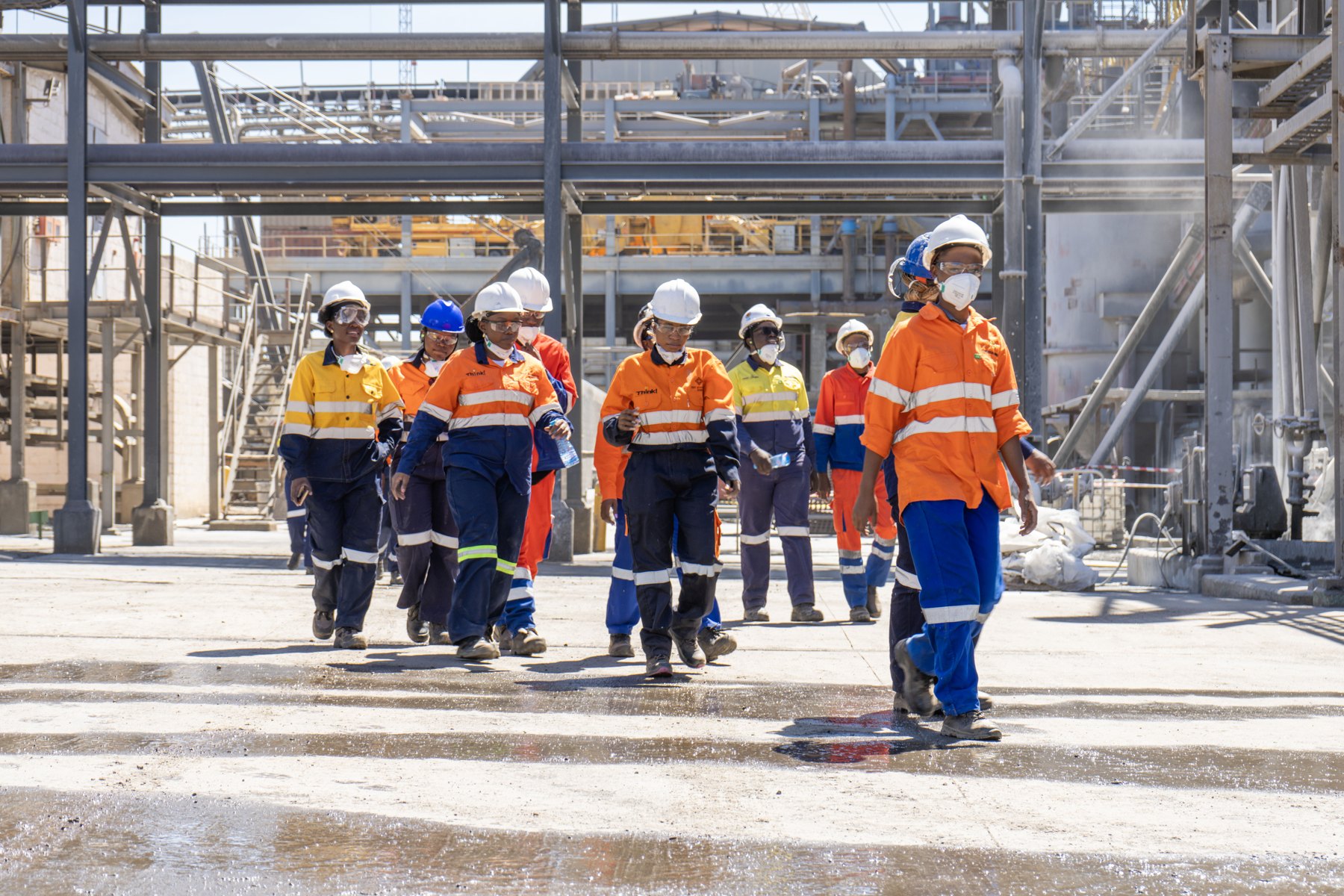 About Personnel walking through a Lumwana industrial site